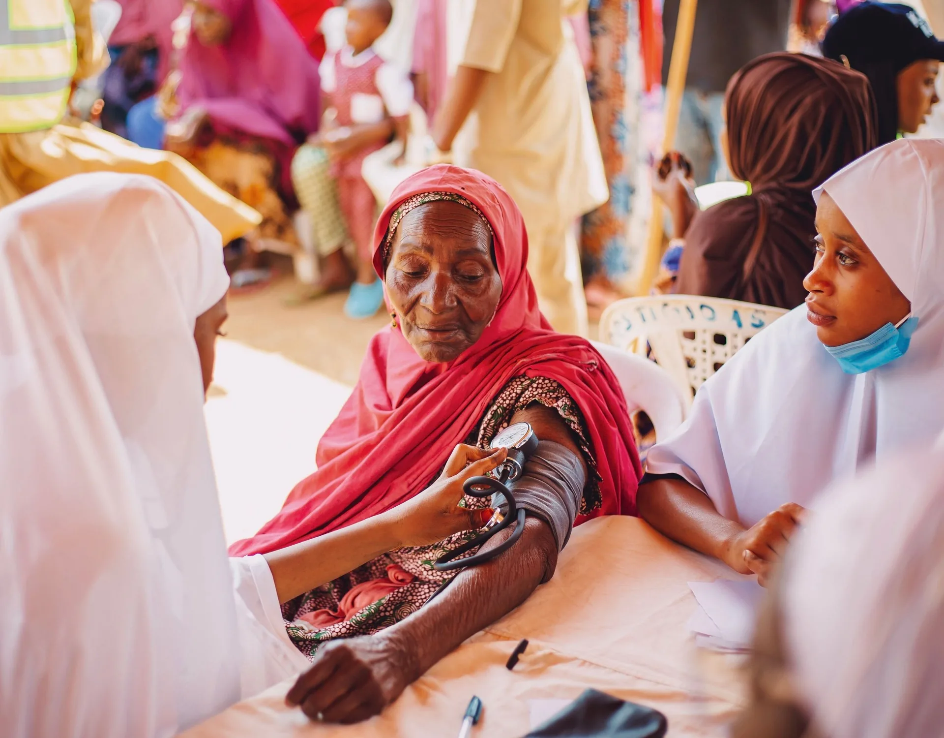 Healthcare professionals supporting a community health screening
